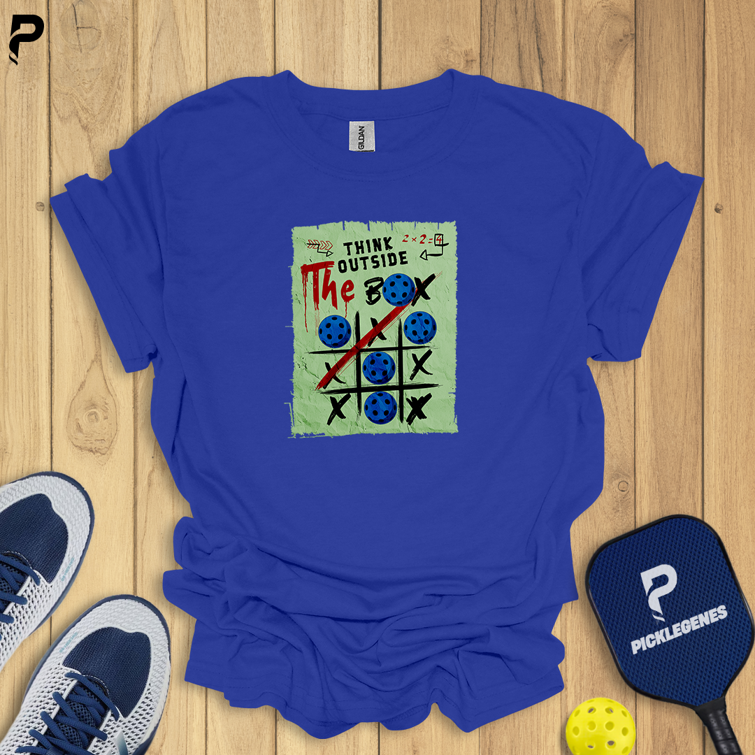Blue t-shirt with a graphic design on a wooden surface with sports equipment.